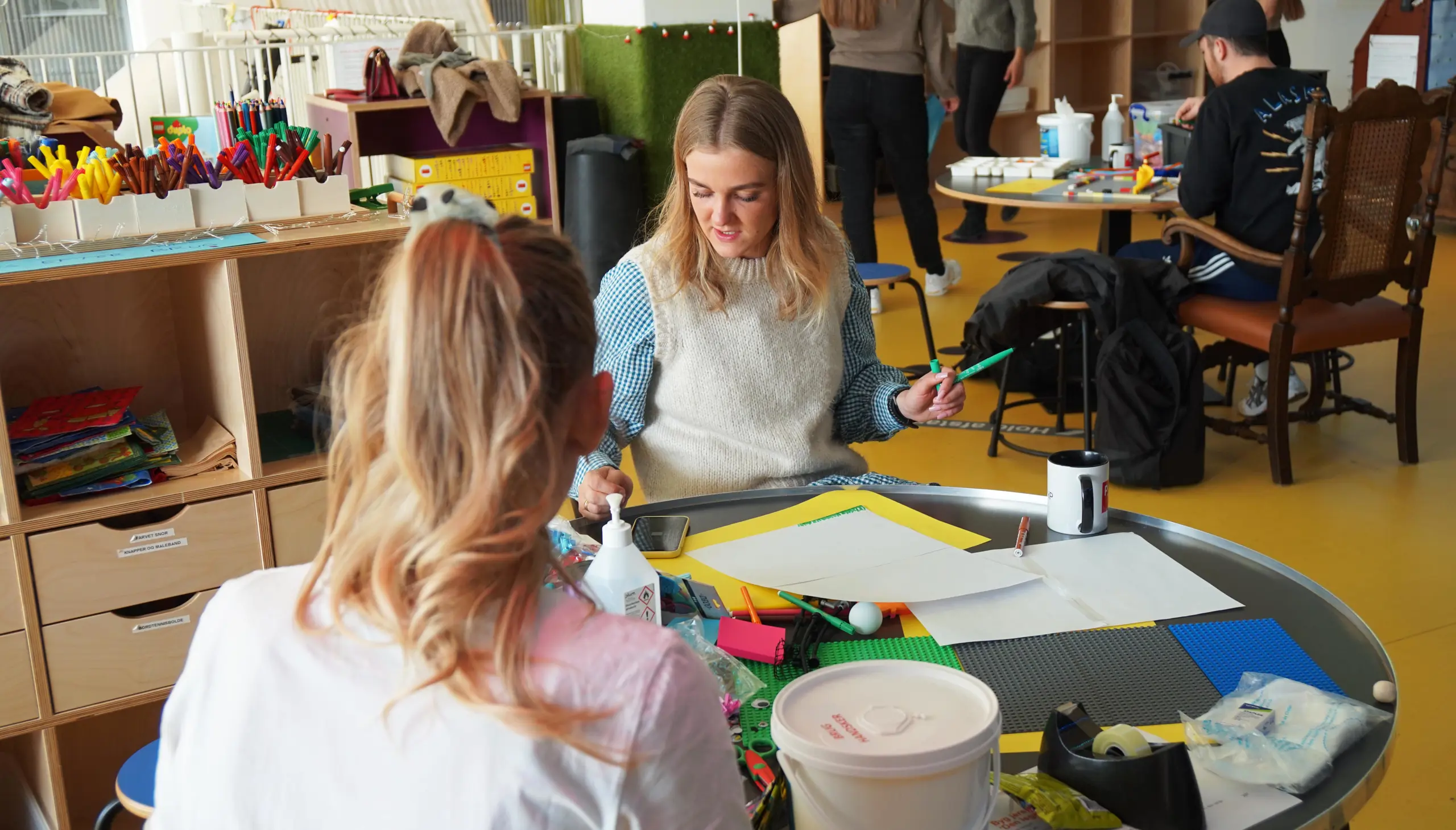 Two trainee teachers tinkering