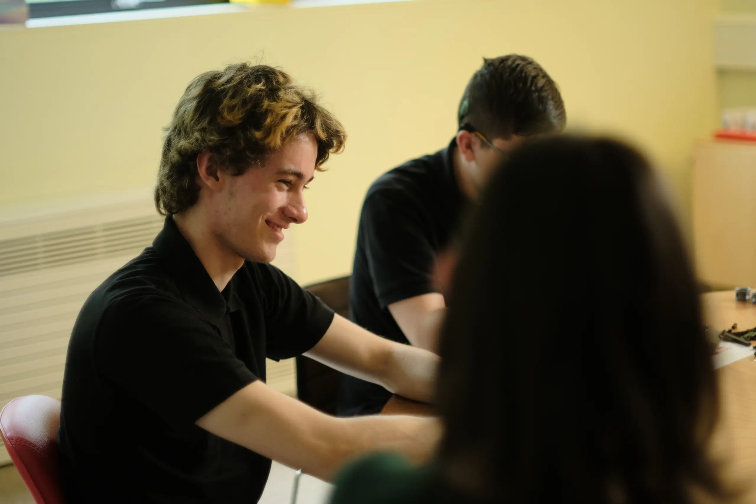 Finlay smiling at his Brick Club mates